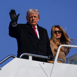 JOINT BASE ANDREWS, MARYLAND - FEBRUARY 13: U.S. President Donald Trump and First Lady Melania Trump board Air Force One on February 13, 2026 at Joint Base Andrews, Maryland. Trump will visit Fort Bragg in North Carolina and then travel to Florida for the weekend. (Photo by Nathan Howard/Getty Images)