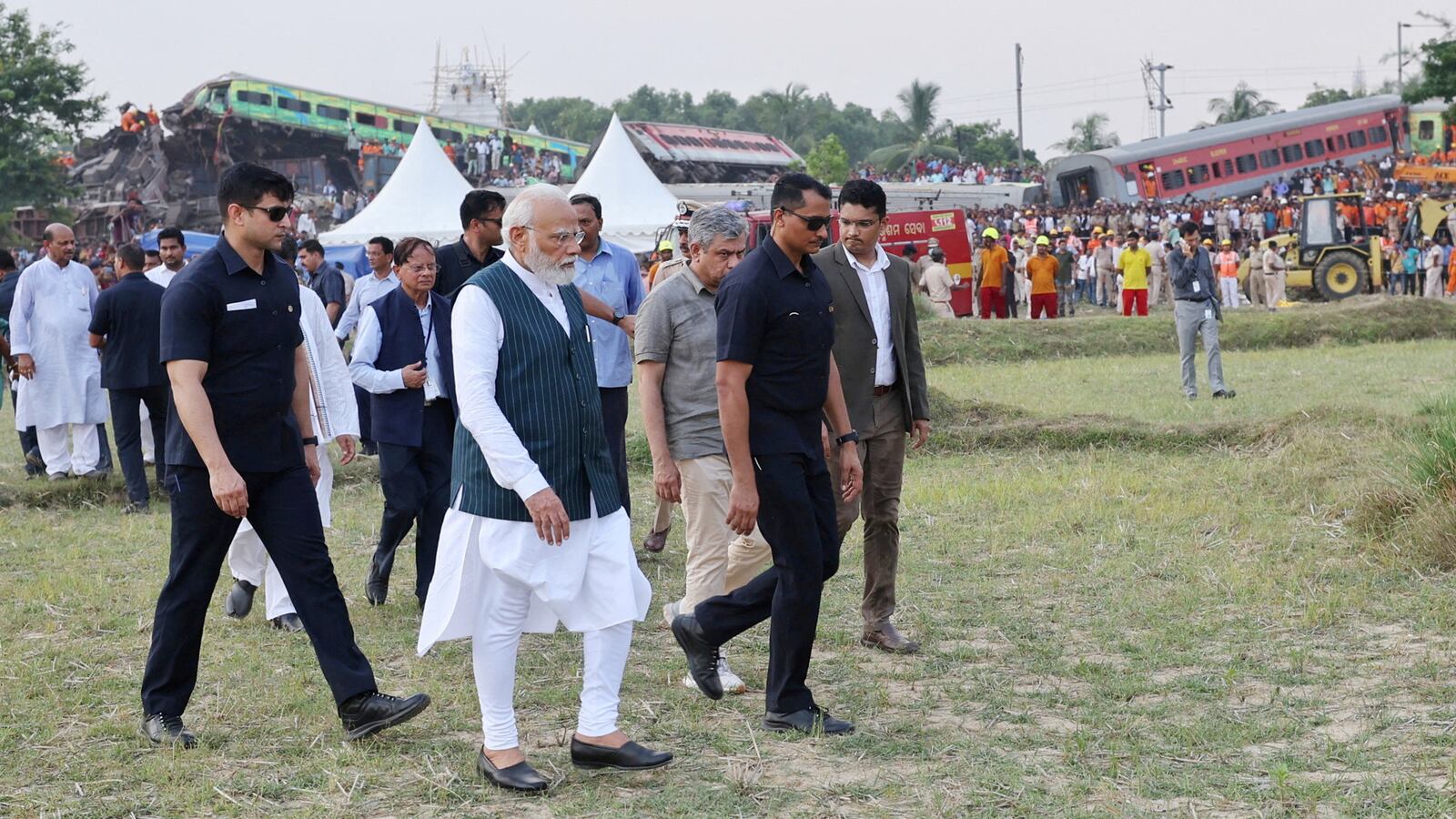 Indian Prime Minister Narendra Modi visits train crash site.