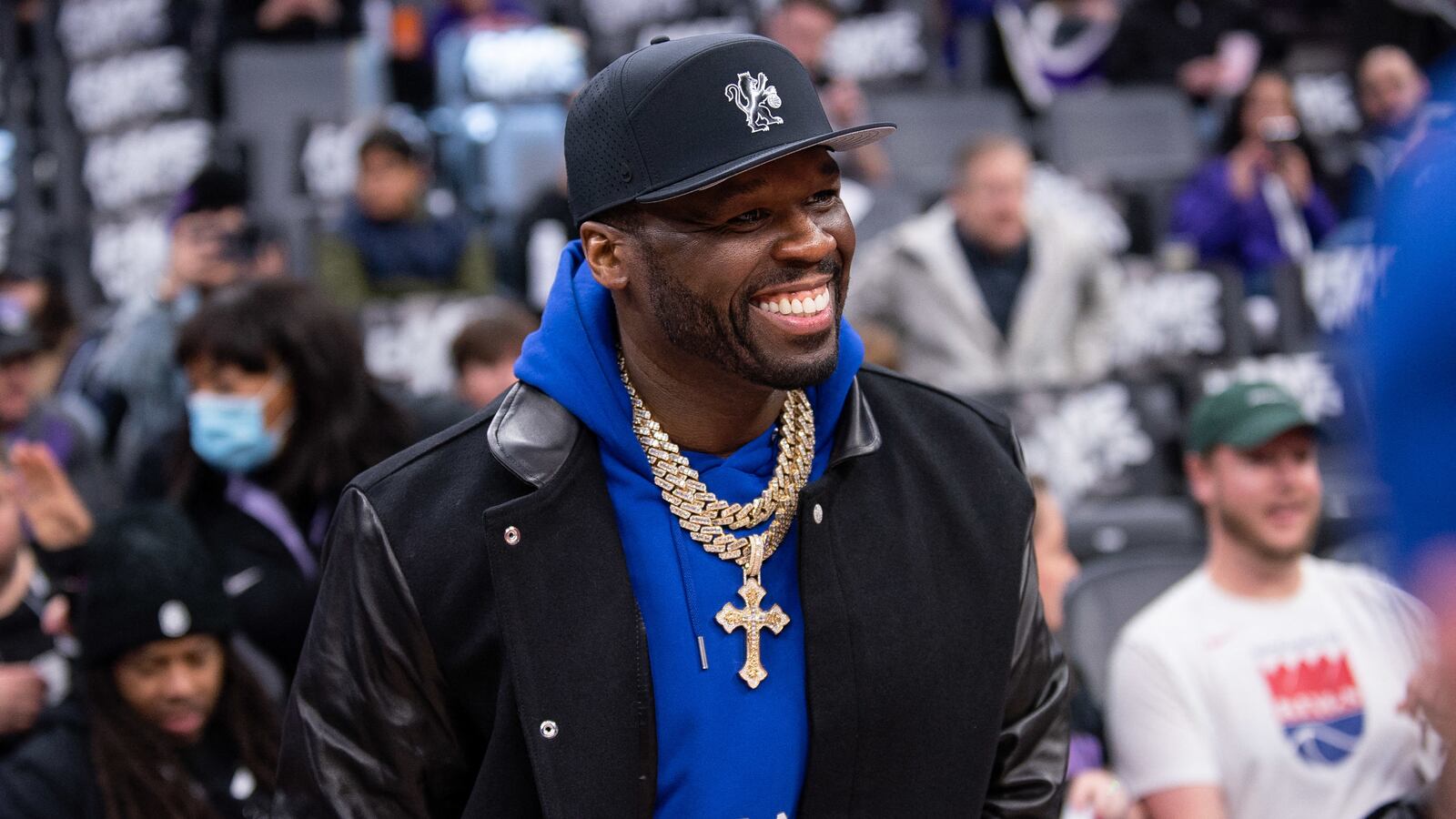 Rapper 50 Cent smiles during warmups of the game between the Sacramento Kings and Houston Rockets