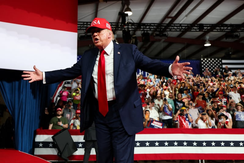 Trump criticized Cooper on crime and hurricane response during his brief trip to North Carolina.