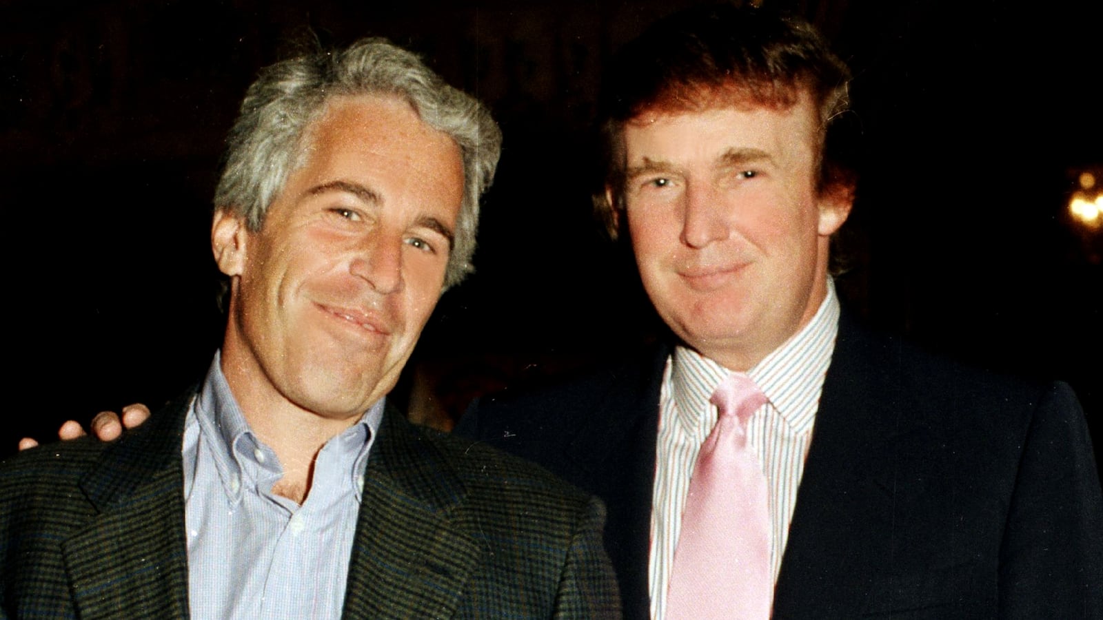 Jeffrey Epstein (left) and Donald Trump as they pose together at the Mar-a-Lago estate, Palm Beach, Florida on February 22, 1997.