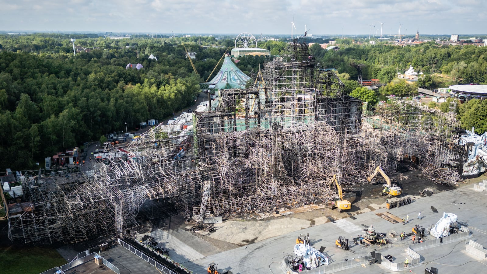 This aerial photograph shows the main stage of the Tomorrowland music festival that was totally destroyed by fire a day before thousands of electronic dance music lovers were due to descend on the Belgian event in Boom, near Antwerp, on July 17, 2025. There were no injuries, organisers said, insisting that they would still go ahead with the festival over the next two weekends. (Photo by Belga / AFP) / Belgium OUT (Photo by -/Belga/AFP via Getty Images)