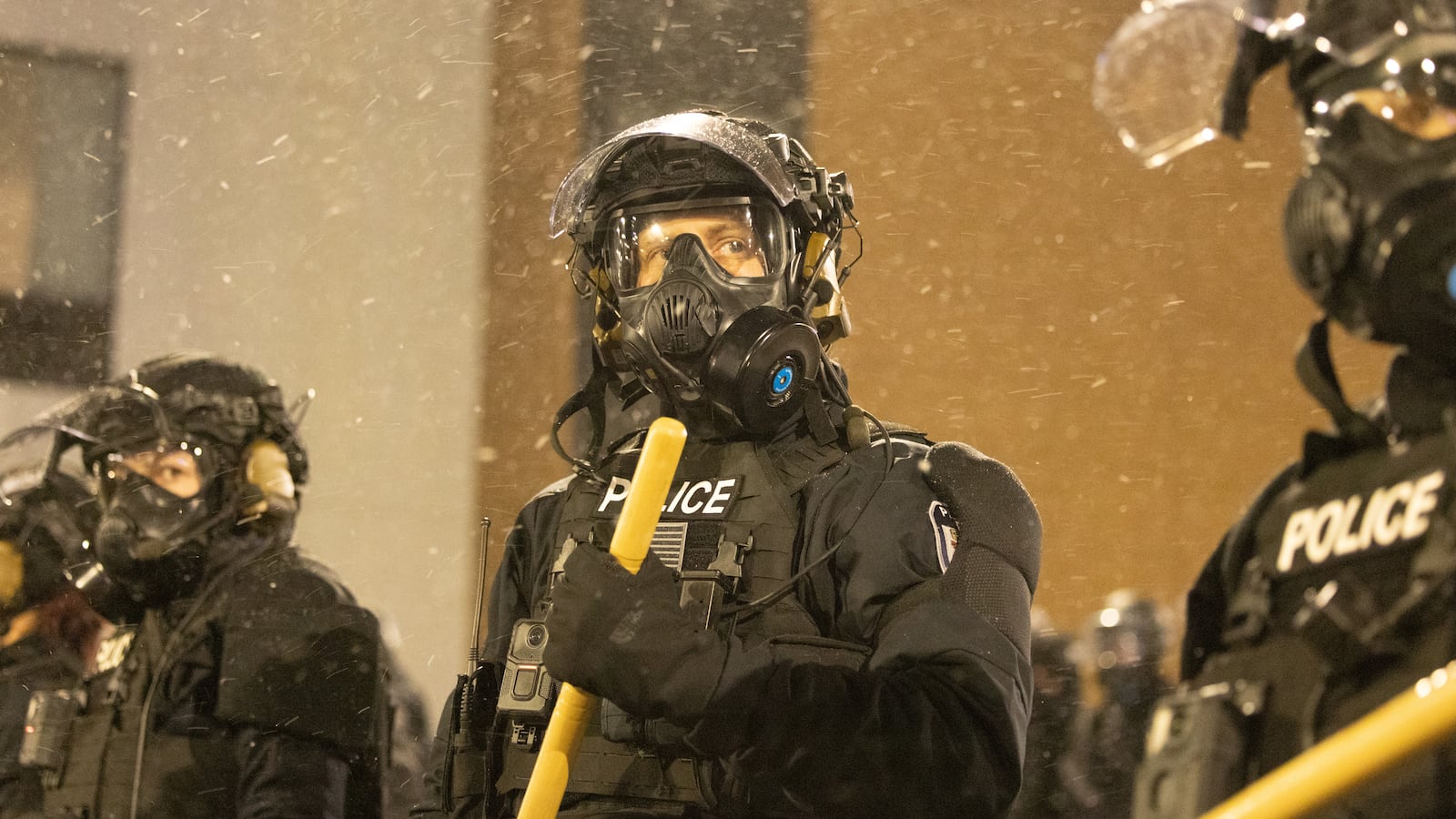 Protesters clash with law enforcement while holding a 'noise demonstration' outside of a hotel believed to be housing federal immigration agents near Minneapolis, United States, on January 26, 2025.