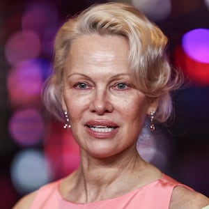 Cast member Pamela Anderson arrives on the red carpet for the premiere of 'Rosebush Pruning' at the 76th Berlinale International Film Festival in Berlin, Germany, on February 14, 2026.