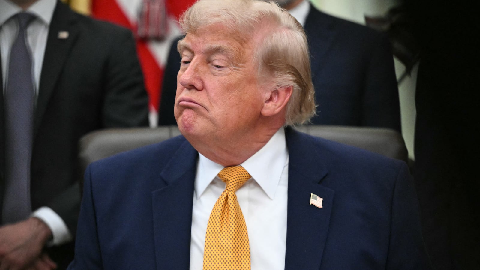 US President Donald Trump looks on after signing an executive order in the Oval Office of the White House in Washington, DC, on June 22, 2026.