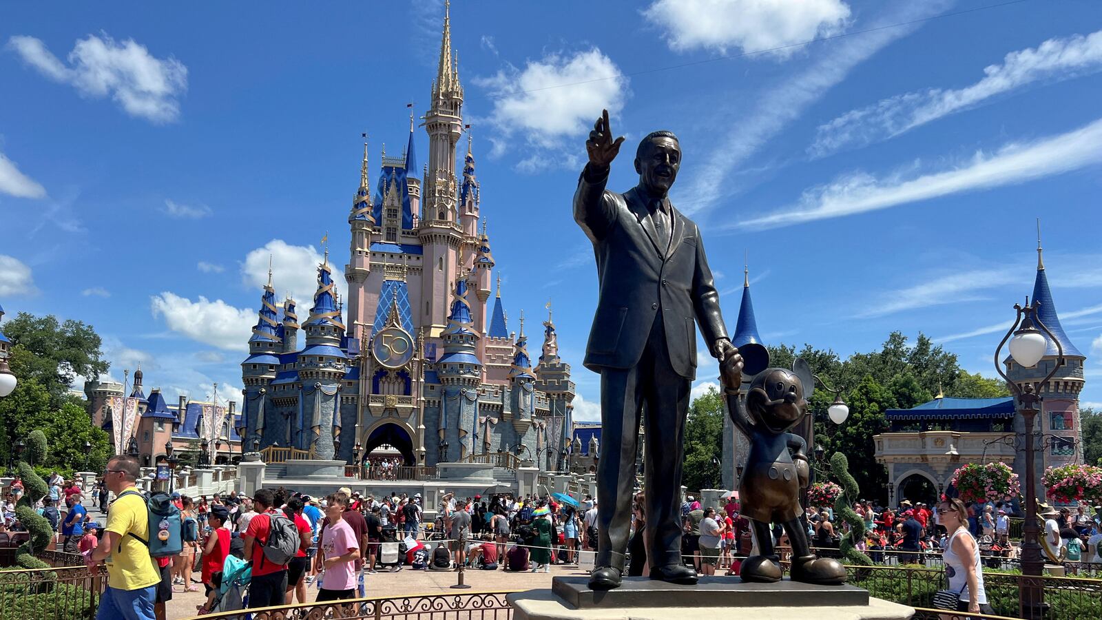People gather at the Magic Kingdom theme park before the "Festival of Fantasy" parade at Walt Disney World in Orlando, Florida, U.S. July 30, 2022.