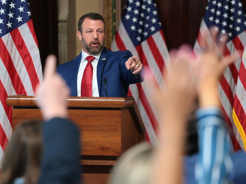 Secretary of Homeland Security Markwayne Mullin points as journalists ask him questions during a July 17, 2026, news conference about election security ahead of the midterms.