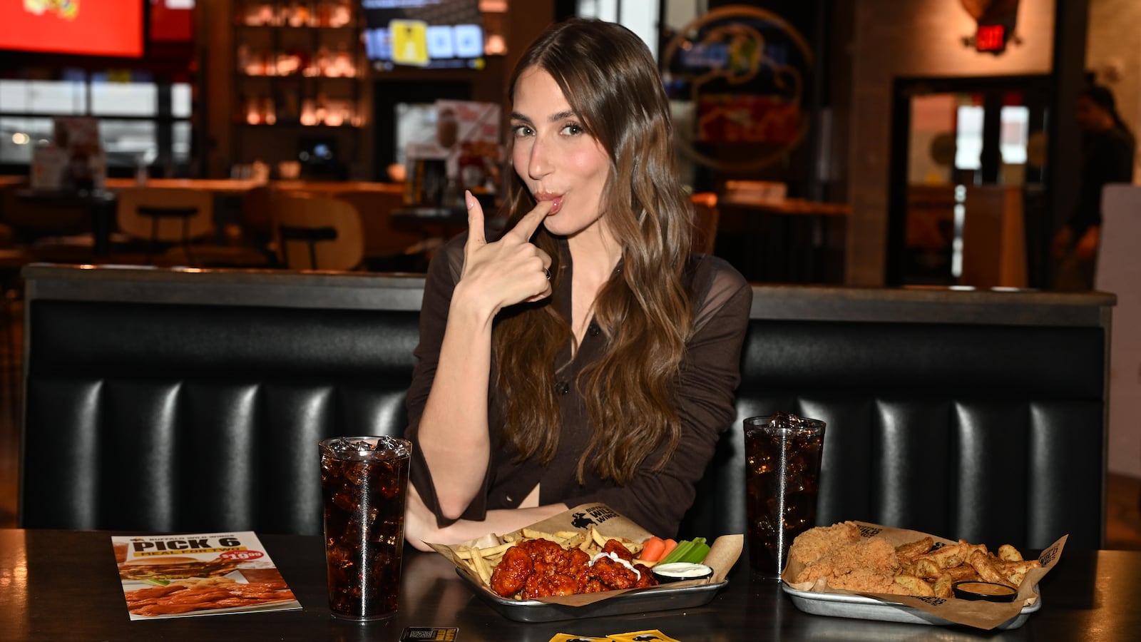 Amanda Batula searches for the perfect Pick 6 date at Buffalo Wild Wings in Wayne, New Jersey.