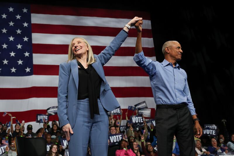 Former U.S. President Barack Obama (R) and Virginia Democratic gubernatorial candidate, former Rep. Abigail Spanberger