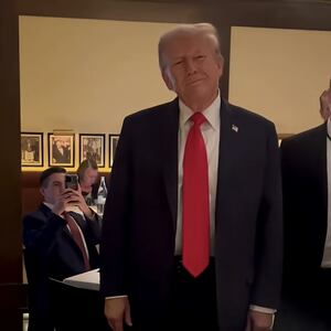 Donald Trump reacts to protesters at a restaurant in Washington, D.C.