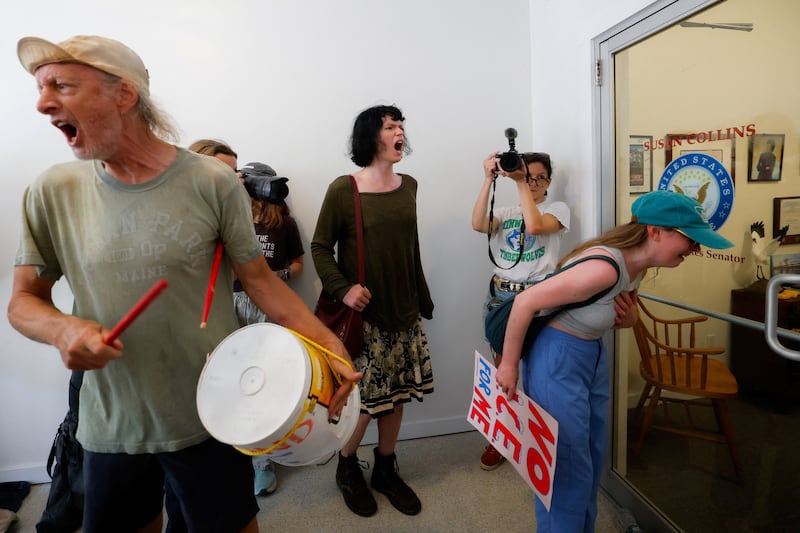 People protest at the entrance to the office of U.S. Senator Susan Collins (R-ME) after a shooting involving U.S. Immigration and Customs Enforcement (ICE) in Biddeford, Maine, U.S. July 13, 2026.  REUTERS/CJ Gunther