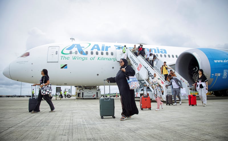 Passengers disembark from an Air Tanzania plane from Dubai, at the Julius Nyerere International Airport after their evacuation, amid the U.S.-Israel conflict with Iran, in Dar es Salaam, Tanzania March 9, 2026. REUTERS/Emmanuel Herman