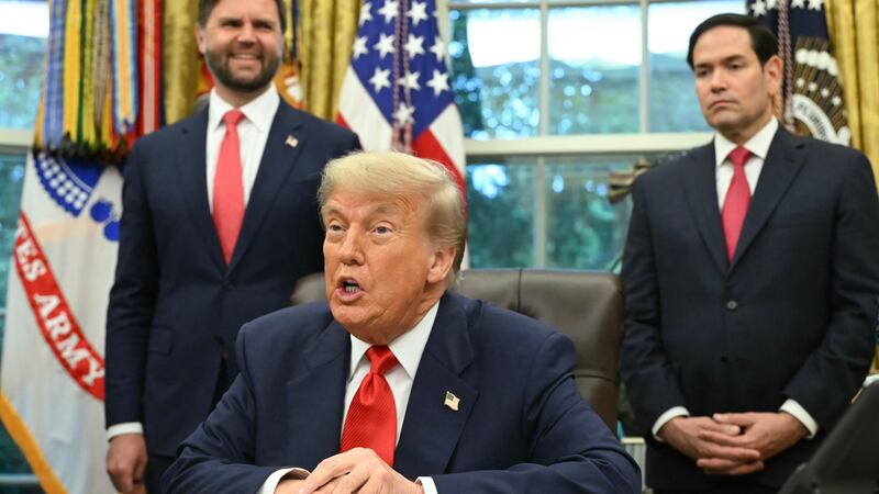 President Donald Trump is flanked by  Secretary of State Marco Rubio and Vice President JD Vance (L) during a meeting in the White House in Washington, D.C. on June 27, 2025.