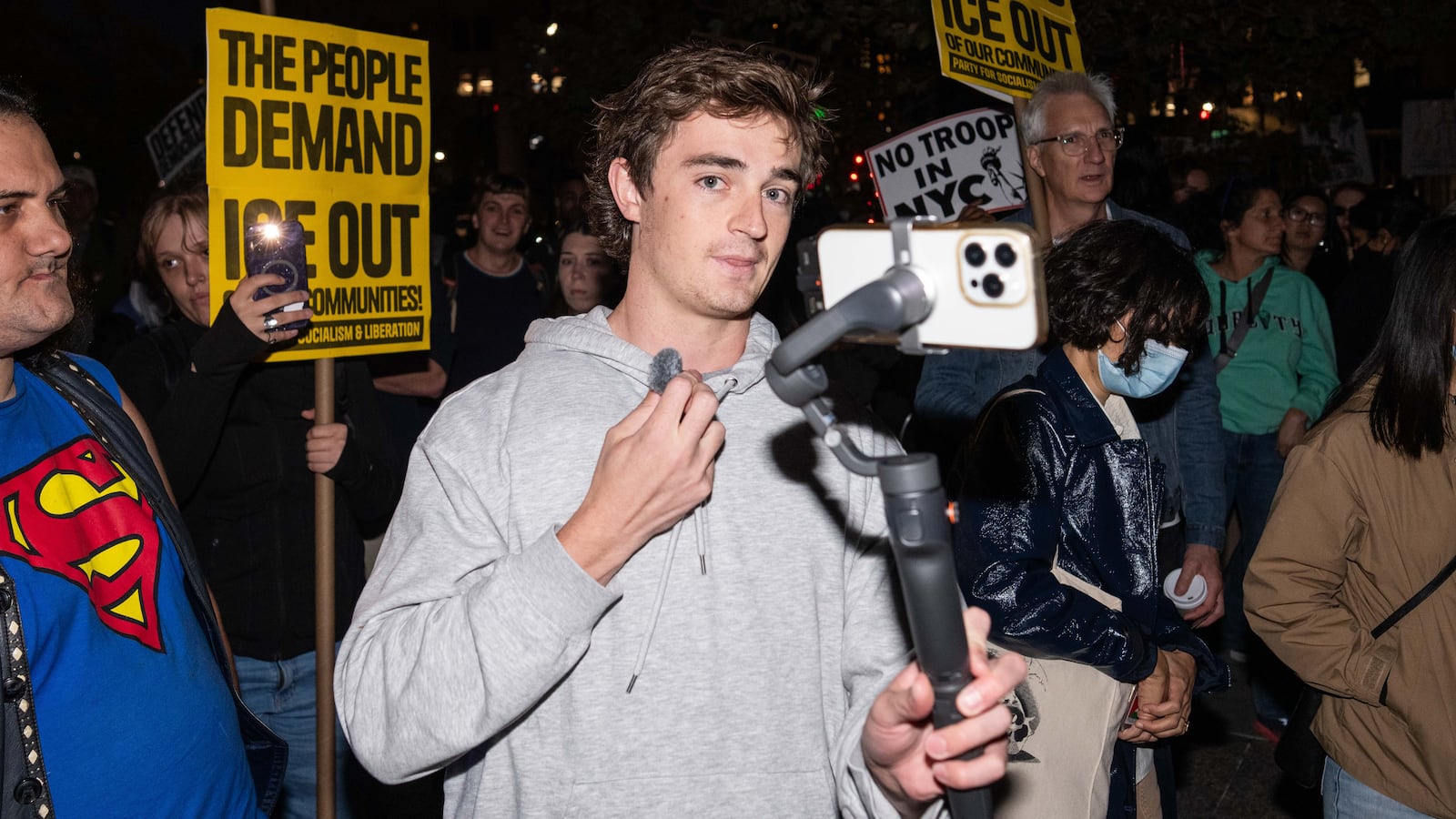 NEW YORK, NEW YORK - OCTOBER 22: Conservative influencer Nick Shirley films protestors demonstrating against U.S. Immigration and Customs Enforcement (ICE) arrests on October 22, 2025 in New York City. Federal agents arrested nine individuals during an operation on Manhattan's Canal Street on Tuesday, targeting undocumented immigrants potentially linked to illegal street vending, according to officials and a senior law enforcement source familiar with the investigation. (Photo by Adam Gray/Getty Images)