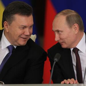 Russian President Vladimir Putin (R) and former President of Ukraine Viktor Yanukovych.