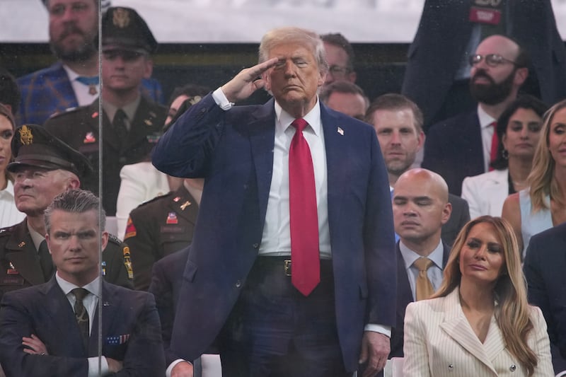 President Donald Trump salutes as members of the U.S Army participate in the 250th birthday parade of the U.S. Army June 14, 2025 in Washington, DC.