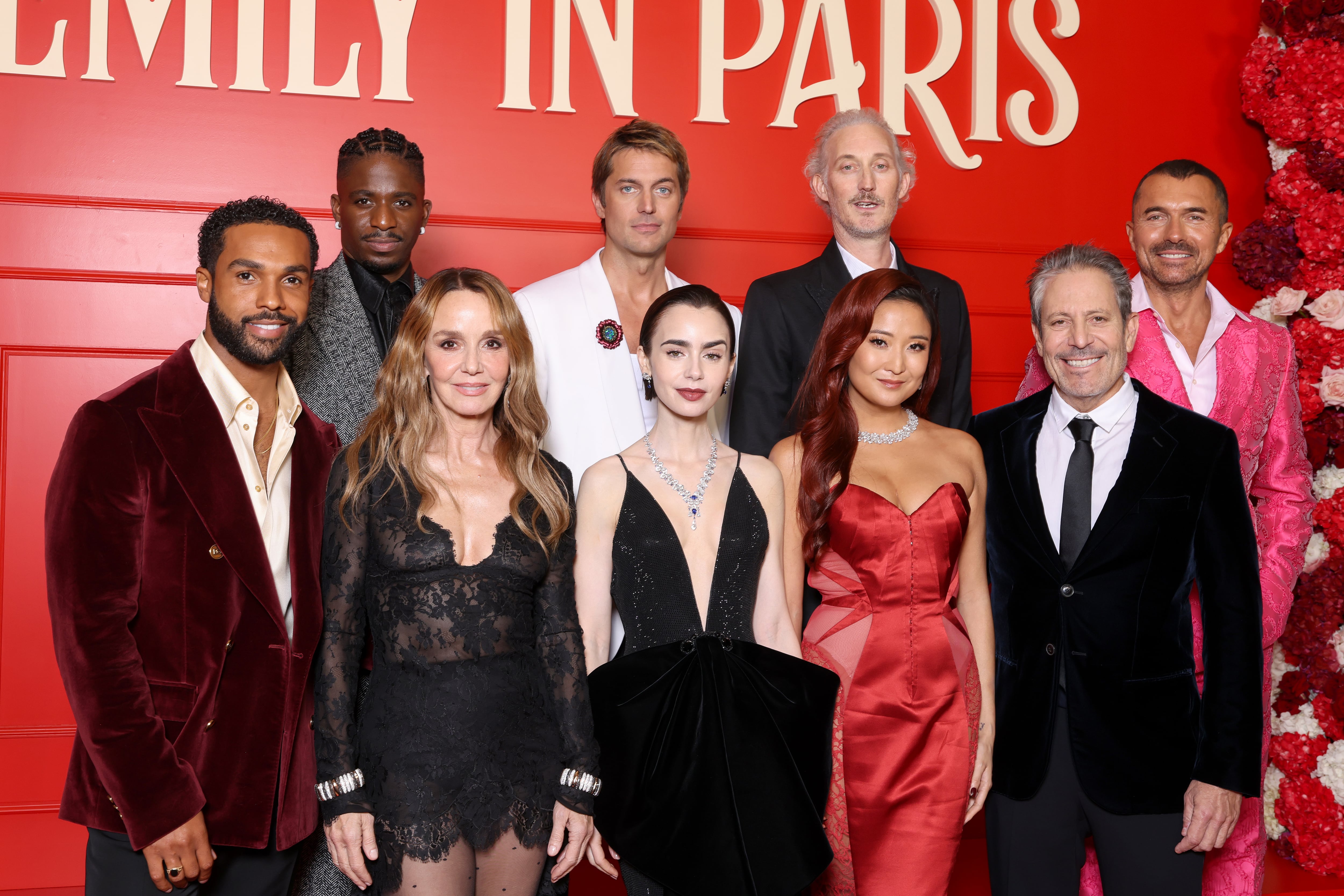 The cast of 'Emily in Paris,' including Lucien Laviscount, Samuel Arnold, Philippine Leroy-Beaulieu, Lucas Bravo, Lily Collins, Bruno Gouery, Ashley Park, Darren Star, and William Abadie, attend the Season 5 premiere at Le Grand Rex in Paris on December 15, 2025.