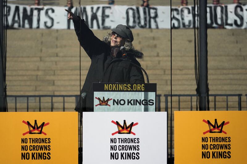Jane Fonda gestures as she speaks behind a glass during a "No Kings" protest against U.S. President Donald Trump's administration policies