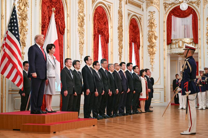 Trump and Takaichi review an honor guard of the Japan Self-Defense Force at the Akasaka State Guest House in Tokyo.