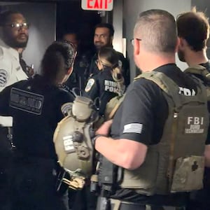A group of uniformed men in a corridor