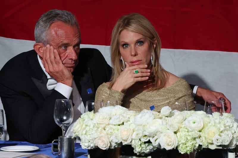 Former presidential candidate Robert F. Kennedy Jr. and his wife Cheryl Hines listen as Republican presidential nominee, former U.S. President Donald Trump speaks during the annual Alfred E. Smith Foundation Dinner at the New York Hilton Midtown on October 17, 2024 in New York City.
