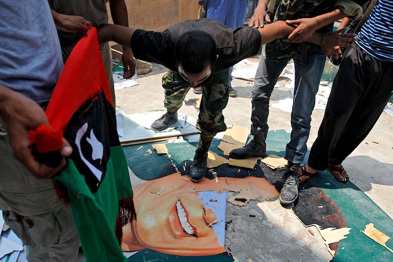 articles/2011/08/24/libya-news-rebels-put-bounty-on-gaddafi-s-head/libya-rebels-qaddafi-kossov_nlvaek