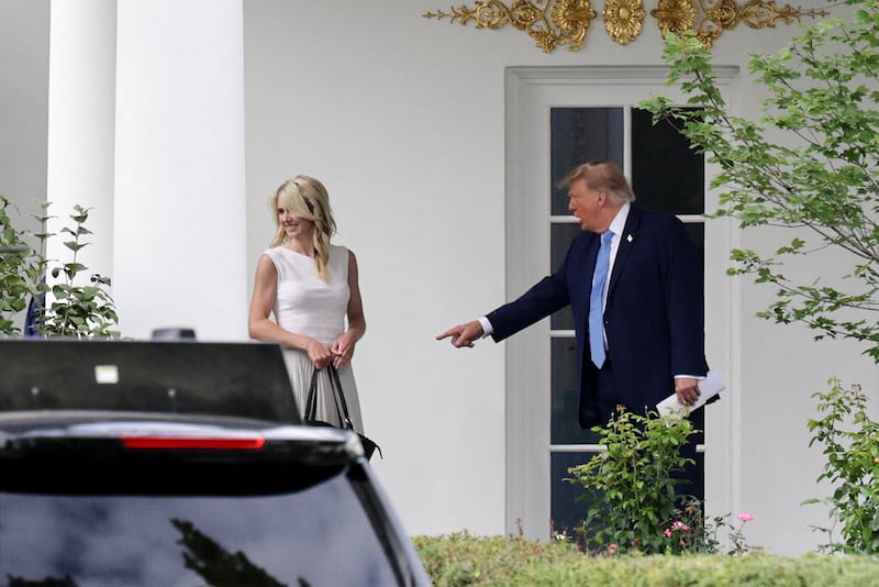 US President Donald Trump and his executive assistant Natalie Harp return from an America.gov AI event to the Oval Office at the White House in Washington, D.C., US, September 29, 2026. REUTERS/Jonathan Ernst