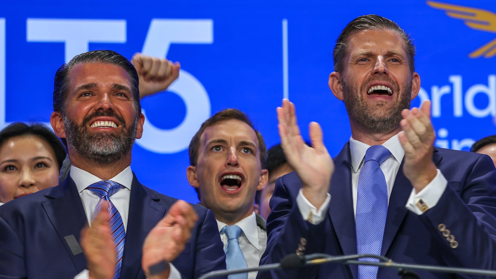 Zach Witkoff flanked by Eric Trump and Donald Trump Jr. in August.