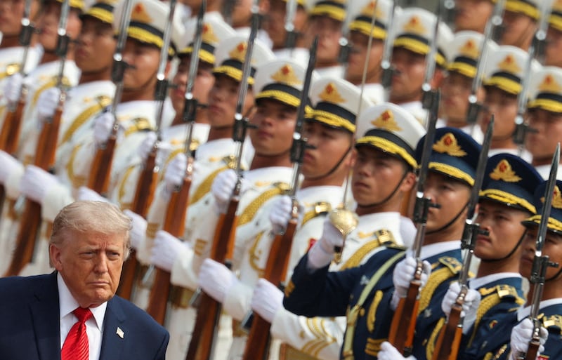 U.S. President Donald Trump inspects an honor guard during a welcome ceremony at the Great Hall of the People, in Beijing, China, May 14, 2026. REUTERS/Maxim Shemetov/Pool