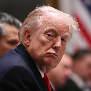 President Donald Trump was seated between Secretary of State Marco Rubio, left, and Defense Secretary Pete Hegseth, right, during Thursday’s meeting.