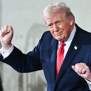 Donald Trump dances on stage next to Melania