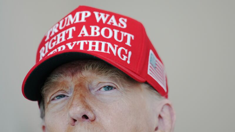 WASHINGTON, DC - AUGUST 22:  U.S. President Donald Trump speaks to the media wearing a hat that reads, "Trump Was Right About Everything!," during a visit to The People's House: A White House Experience August 22, 2025 in Washington, DC.  Trump spoke on a variety of issues including stating he did not know of the FBI raid currently happening on former national security adviser John Bolton's home, and saying he learned of it by seeing the news on television.  (Photo by Kevin Dietsch/Getty Images)