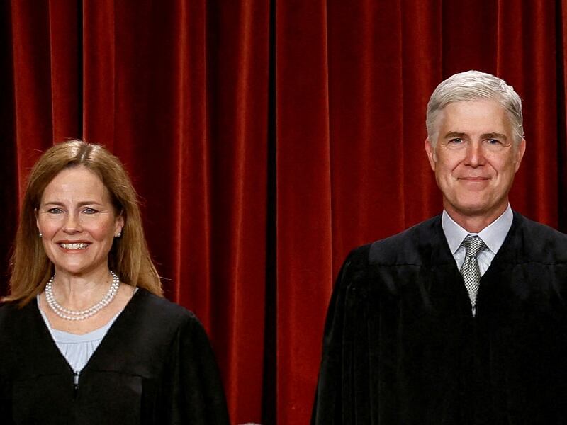 FILE PHOTO: U.S. Supreme Court justices pose for their group portrait at the Supreme Court in Washington, U.S., October 7, 2022. Seated (L-R): Justices Sonia Sotomayor, Clarence Thomas, Chief Justice John G. Roberts, Jr., Samuel A. Alito, Jr. and Elena Kagan. Standing (L-R): Justices Amy Coney Barrett, Neil M. Gorsuch, Brett M. Kavanaugh and Ketanji Brown Jackson. REUTERS/Evelyn Hockstein      TPX IMAGES OF THE DAY/File Photo