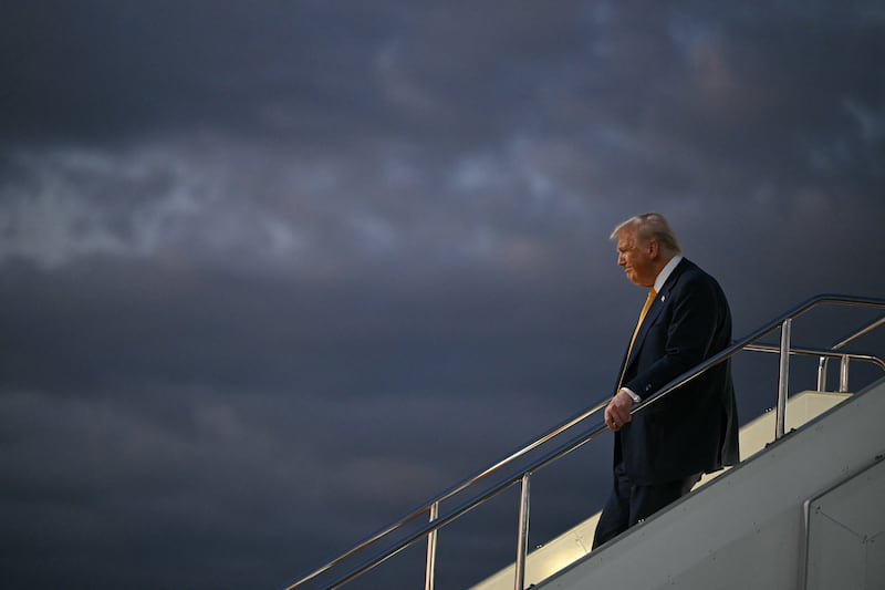 US President Donald Trump alights from Air Force One upon arrival at Haneda Airport in Tokyo
