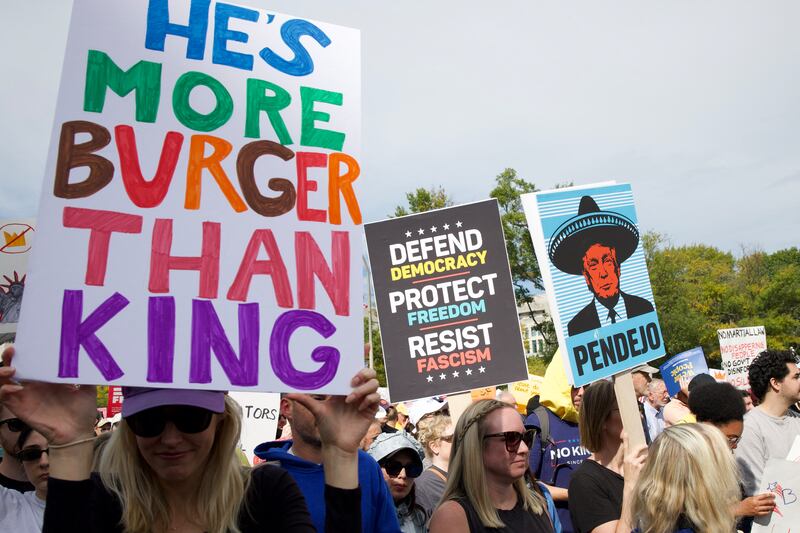 People participate in a "No Kings" national day of protest in Washington, DC, on October 18, 2025.