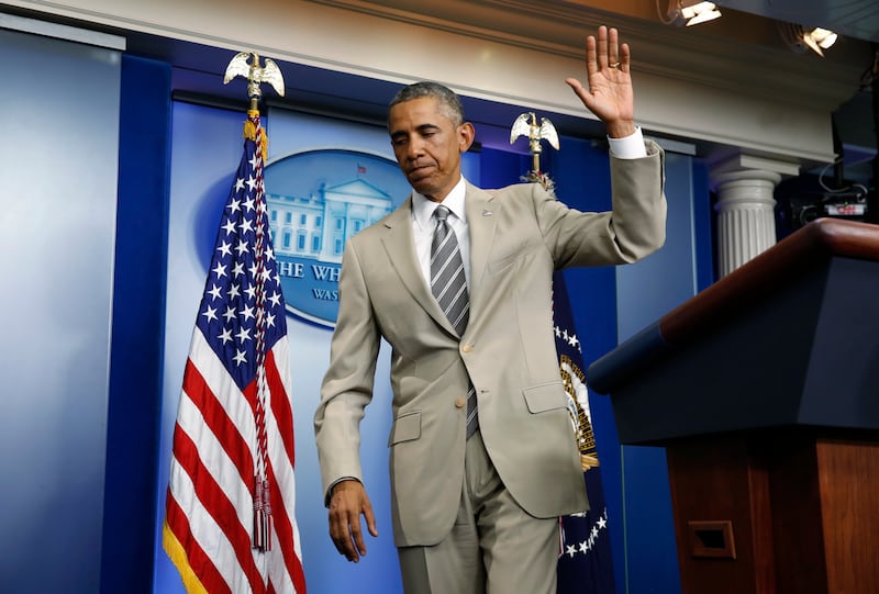U.S. President Barack Obama departs the White House Press Briefing Room after addressing reporters in Washington, August 28, 2014.