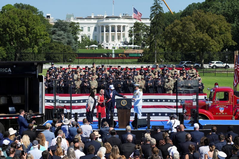 U.S. President Donald Trump presents the Presidential Medal of Freedom to Alison Crowther, on behalf of her son Welles Remy Crowther, a volunteer firefighter who died in the September 11, 2001, attacks, during a Steel Across America event featuring a 21-foot steel beam recovered from the World Trade Centre South Tower, on the Ellipse near the White House in Washington, D.C., U.S., September 8, 2026.