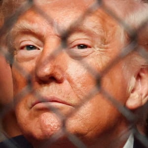 U.S. President Donald Trump watches a match during the UFC 327 event at Kaseya Center in Miami, Florida, U.S., April 11, 2026.  REUTERS/Kevin Lamarque      TPX IMAGES OF THE DAY