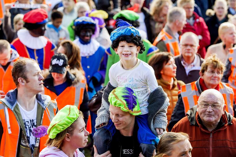 articles/2013/11/11/amsterdam-s-racist-black-pete-parade-under-fire/131110-taylor-blackface-tease_udbkxc