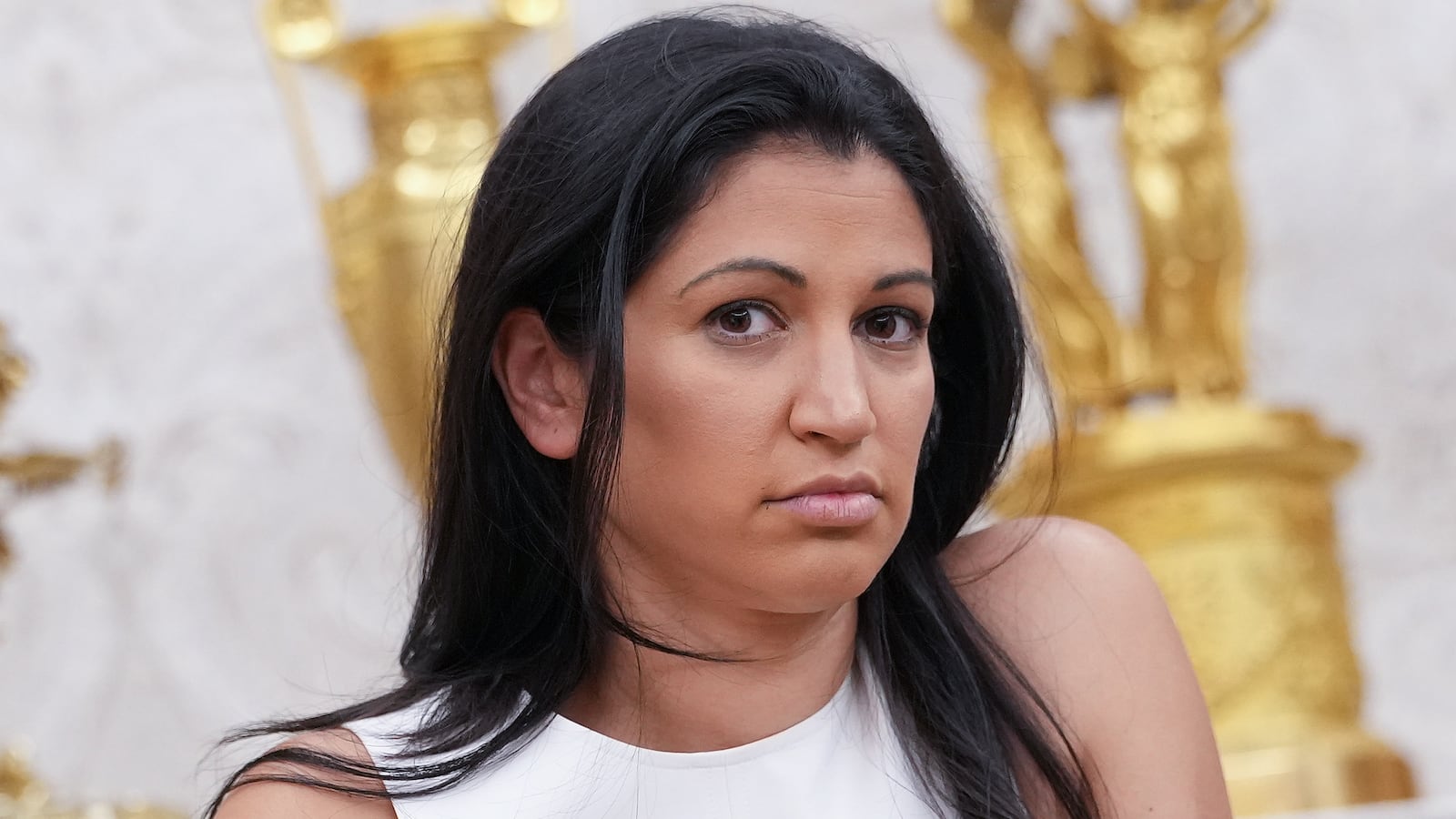 White House Deputy Chief of Staff Stephen Miller's wife, Katie Miller, listens as U.S. President Donald Trump and Tesla CEO Elon Musk speak to reporters in the Oval Office of the White House on May 30, 2025 in Washington, DC.