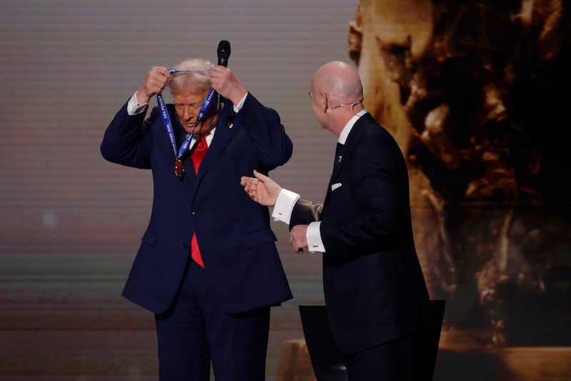 Trump receives the FIFA Peace Prize from FIFA President Gianni Infantino.