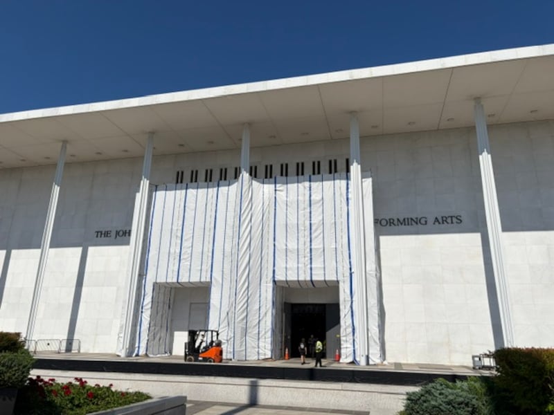 Scaffolding and tarps blocking the sign at the The Kennedy Center on June17, 2026, days after the performing arts center's deadline to remove President Donald Trump's name.