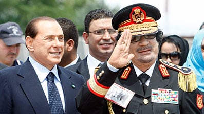 cheats/2009/06/10/gaddafi-berlusconi-meet-in-italy/berlusconi-gaddafi_pbhjx9