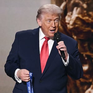 President Donald Trump speaks as he receives the inaugural FIFA Peace Prize alongside FIFA President Gianni Infantino during the draw for the 2026 FIFA Football World Cup in Washington, DC, on December 5, 2025.
