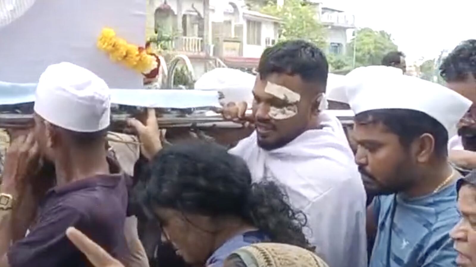 Vishwashkumar Ramesh, the sole survivor of the Air India crash involving a Boeing 787-8 Dreamliner, carries the coffin of his brother, Ajay, who was also killed in the crash.