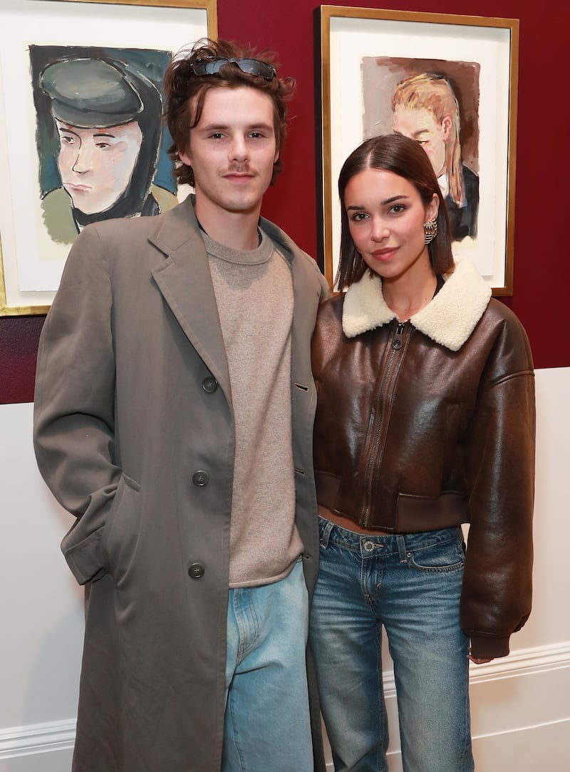 LONDON, ENGLAND - MAY 08: Cruz Beckham (L) and Jackie Apostel attend the a private view of the "Bob Dylan: Point Blank" exhibition hosted by Halcyon Gallery on May 08, 2025 in London, England. (Photo by Dave Benett/Getty Images for Halcyon Gallery)