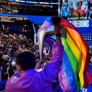 An attendee waves a flag in support of LGBTQ rights on Day 3 of the Democratic National Convention in Chicago