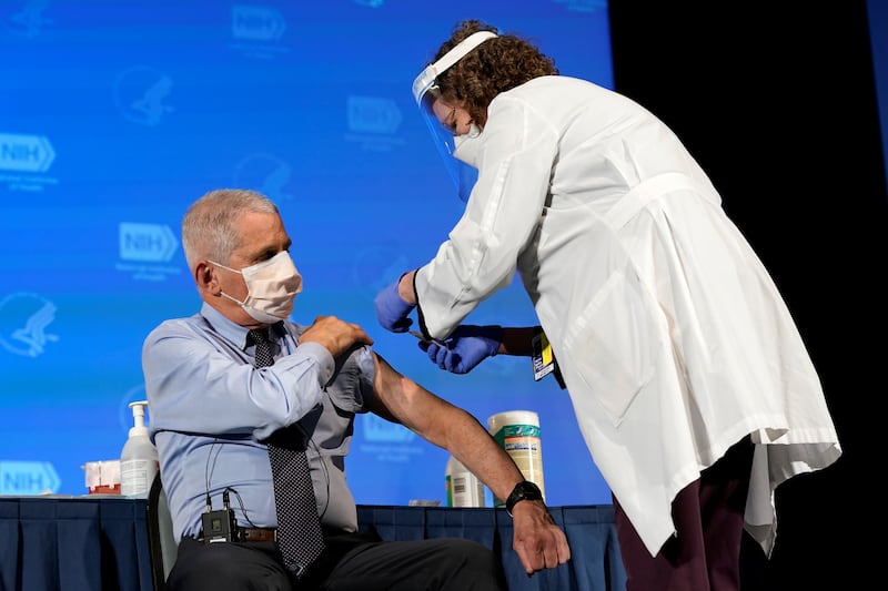 Dr. Anthony Fauci, director of the National Institute of Allergy and Infectious Diseases, receives his first dose of the new Moderna COVID-19 vaccine at the National Institutes of Health, in Bethesda, U.S., December 22, 2020.