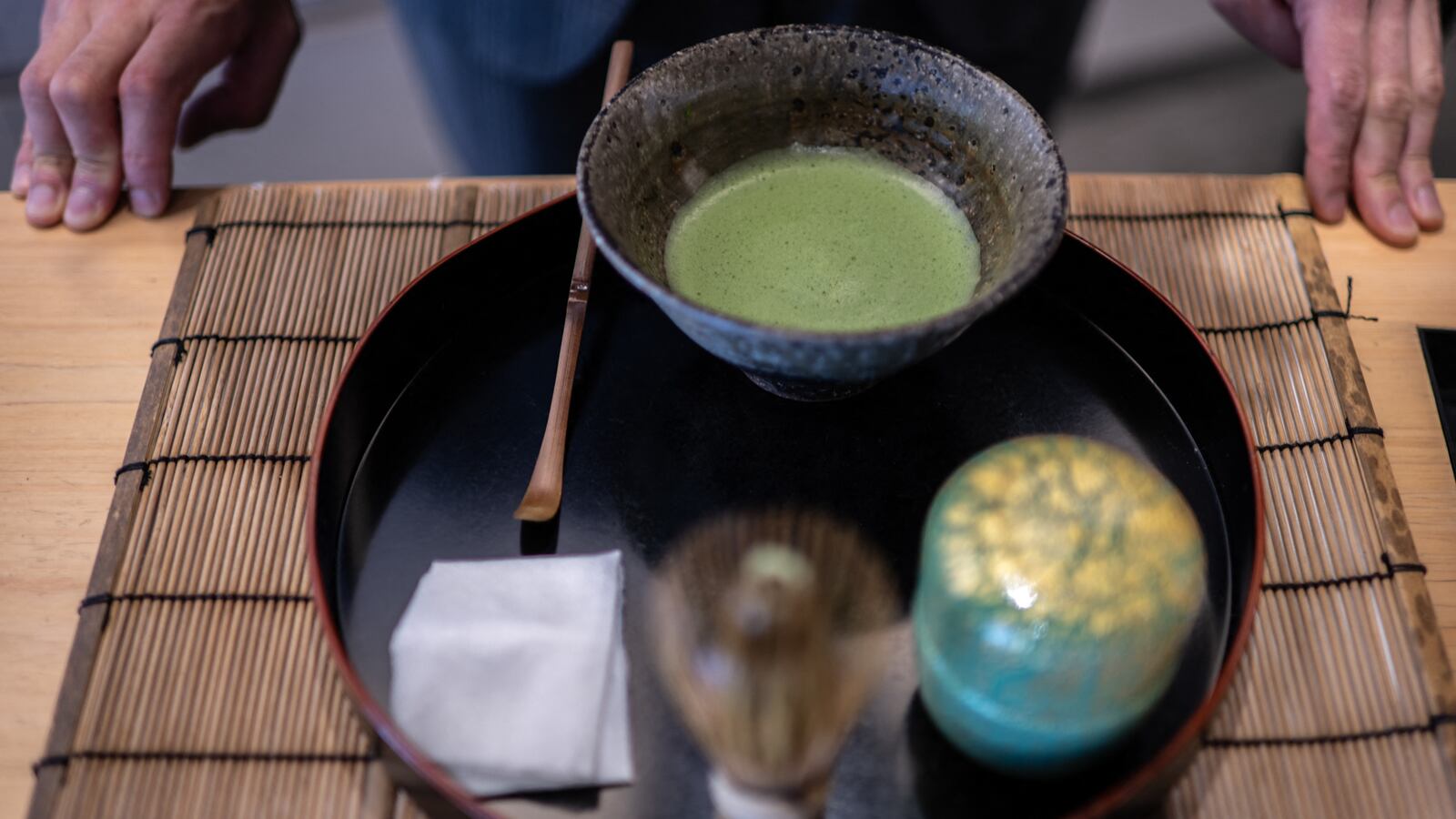 This picture taken on June 6, 2025 shows manager of Jugetsudo tea store Shigehito Nishikida making a bowl of matcha in Tokyo. With its deep grassy aroma, intense colour and pick-me-up effects, the popularity of matcha "has grown just exponentially over the last decade, but much more so in the last two to three years", the 40-year-old explained. (Photo by Philip FONG / AFP) / TO GO WITH: Japan-US-food-drink-lifestyle-internet-agriculture, FOCUS by Caroline Gardin, with Romain Fonsegrives in Los Angeles (Photo by PHILIP FONG/AFP via Getty Images)