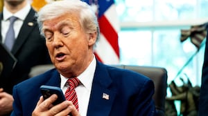 President Donald Trump, pictured silencing his cellphone in the Oval Office on May 23, has long been known for picking up the phone and making calls to reporters to get his side of a story out.